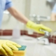 Janitor Cleaning Up Public Bathroom In Business Building