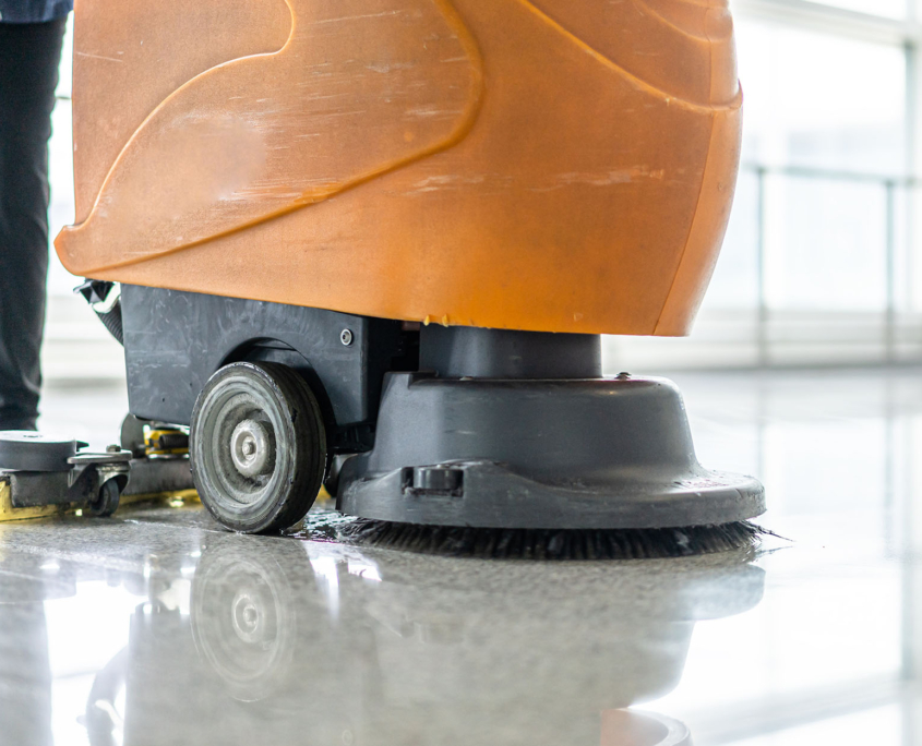 Close Up View Of A Floor Scrubbing Machine