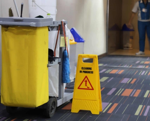 Hotel day porter working on cleaning public areas