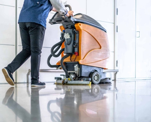 cleaning floor with machine