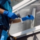 Worker Cleaning Window