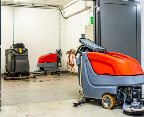 Industrial Cleaning Equipment In A Storage Area With Multiple Machines